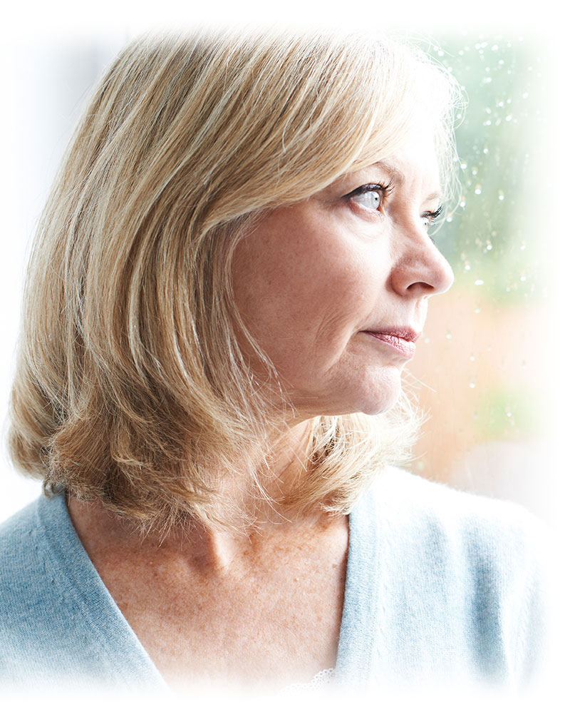 worried dental implant patient staring out window
